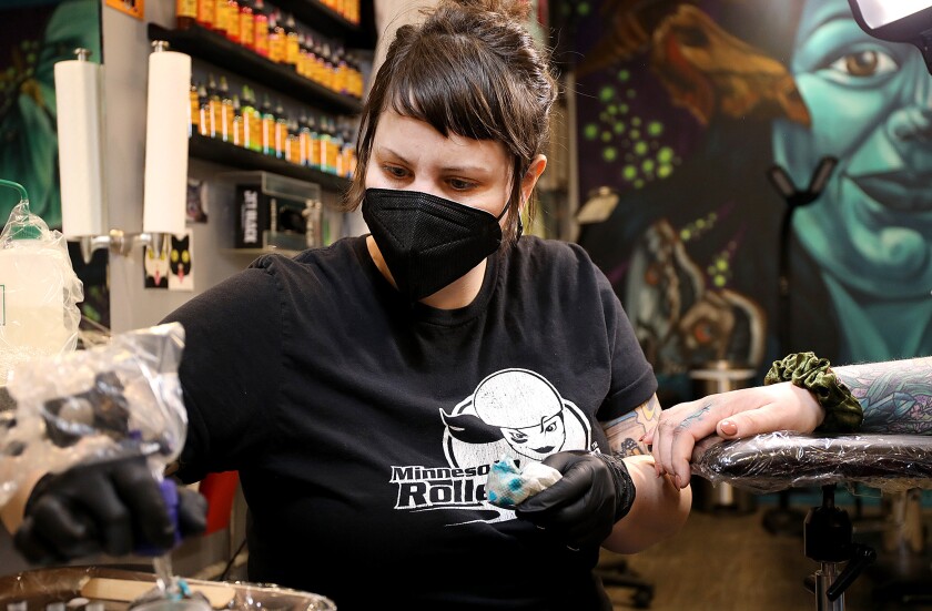 Tattoo artist Abby Jean Goodell gets more ink onto her machine