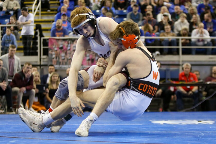 Ben DeForest of Bismarck wrestles Kellan Larson of Williston in the 133-pound championship match at the North Dakota Class A individual state wrestling championships at the Fargodome on Friday, Feb. 21, 2025.