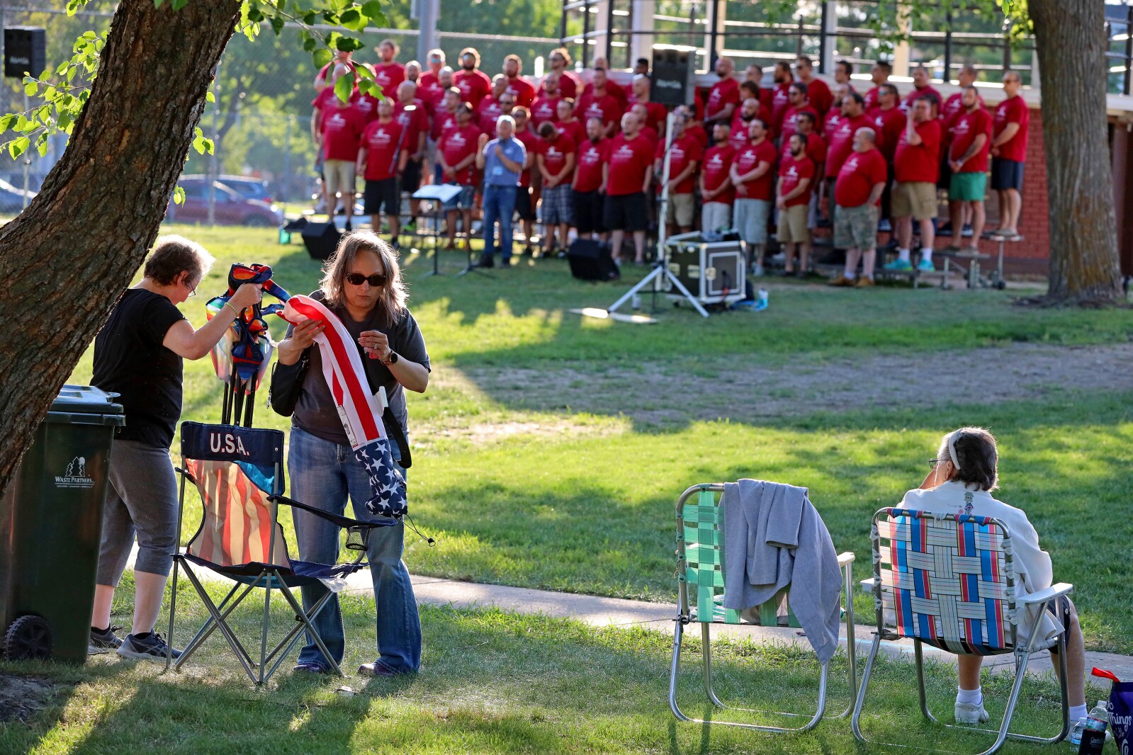 People enjoy a concert in the park