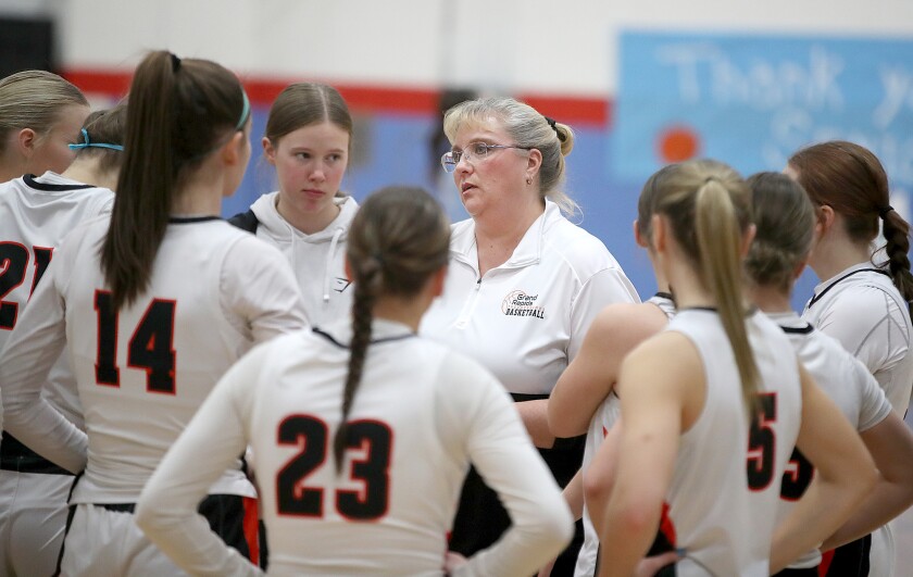 Coach talks to her team.