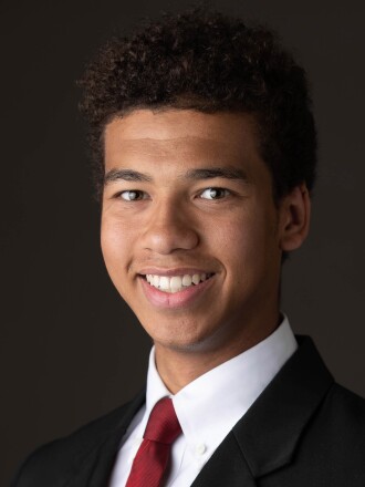 Isaiah Saville UNO Mavericks mug 19-20.jpg