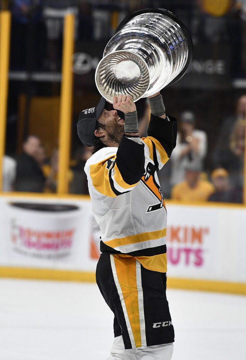 Pittsburgh Penguins center Matt Cullen (7) hoists the Stanley Cup after defeating the Nashville Predators in game six of the 2017 Stanley Cup Final at Bridgestone Arena. Christopher Hanewinckel-USA TODAY Sports