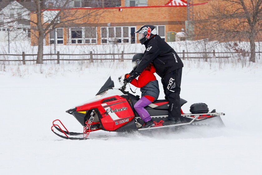 Snow mobilers on Serpent Lake during the 18th annual Cuyuna Lakes Ice Fishing Contest and Scorpion Homecoming.