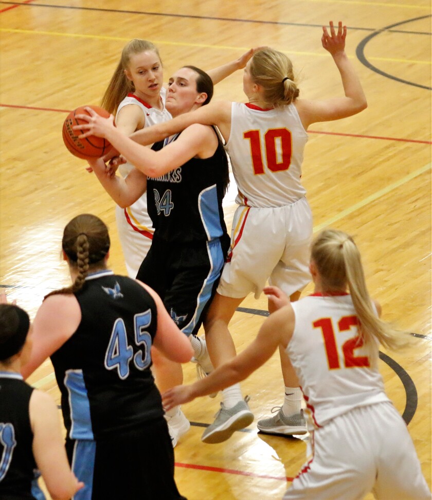 Tripp-Delmont/Armour's Mattilynn Reiner goes up for a shot as Avon's Lauren Sees and Alexa Sees (10) try to strip the ball. (Ryan Deal / Republic)