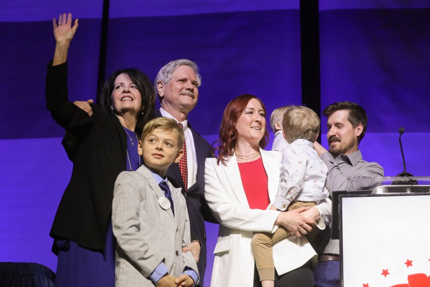 North Dakota Sen. John Hoeven and his family celebrate on stage after he received the North Dakota Republican Party's endorsement at its 2022 state convention on April 2, 2022, in Bismarck.