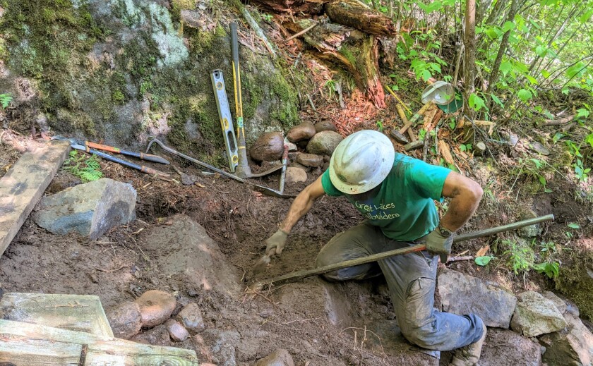 Using hand tools to build stone steps at Stairway Portage in the BWCAW