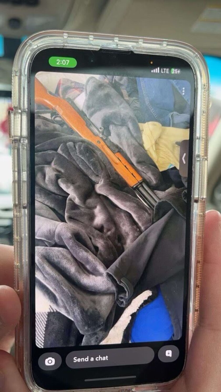 A Snapchat photo shared on Jan. 21, 2024, is captured on a smartphone as evidence a 10th grade boy in the Wadena-Deer Creek School District threatened a 10th grade girl from an interracial Wadena family with bodily harm.