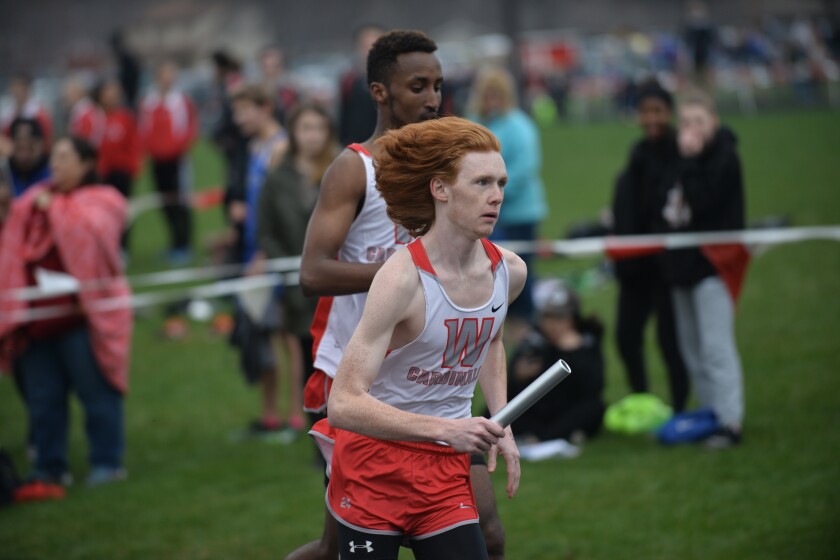 Shawn Mellies-U'Ren of Willmar takes the baton to kick off the third leg of the 4x800 relay on Thursday at the Willmar Invitational. Curt Hogg / Tribune