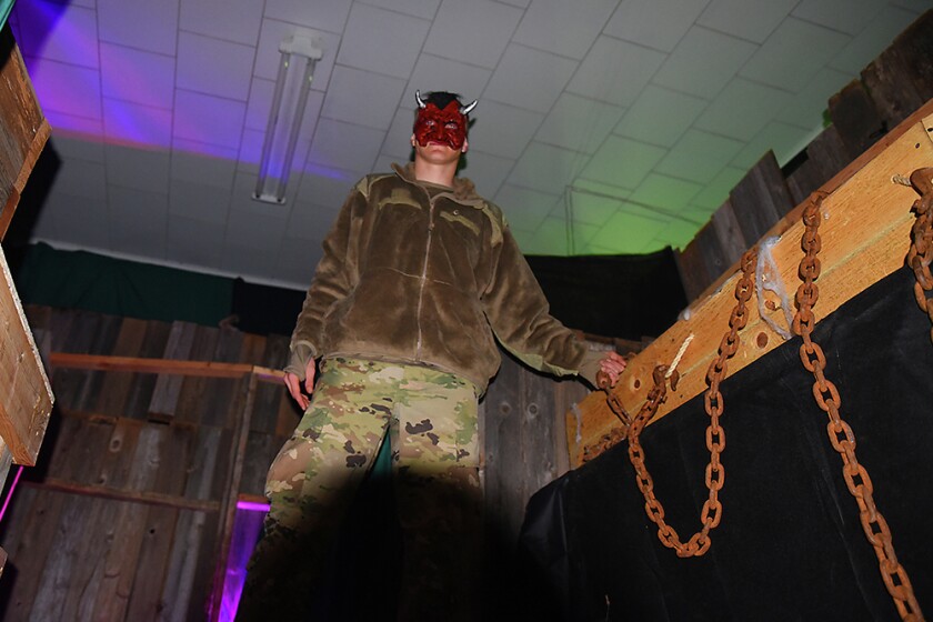 Briana Sanchez / TribuneTim Harrison rattles chains as people go through the Deegers Freak Show haunted house Sunday night. The haunted house was put on by the Willmar Noon and Nite Lions. Regular admission is $10. Admission is $8 with the donnation of a canned food item for the Willmar Area Food Shelf.
