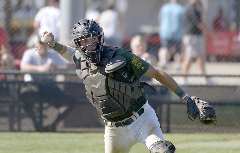 Tri-Town catcher Logan Straumann picks up the ball for a throw to first base during the DII State American Legion Baseball quarterfinals against DGF on Friday, July 29, 2022 at Redbird Field in Luverne.