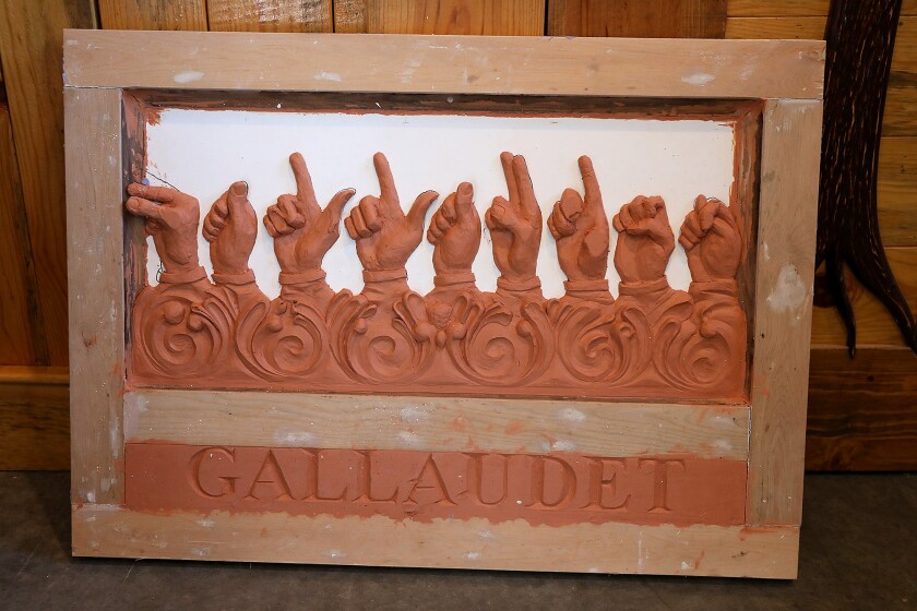 An early mold of a plaque to honor Thomas Hopkins Gallaudet, the founder of the American School for the Deaf, sits on the floor of artist Steven Peterson’s home