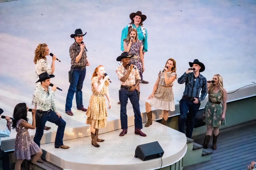 The "Medora Musical" cast is shown.