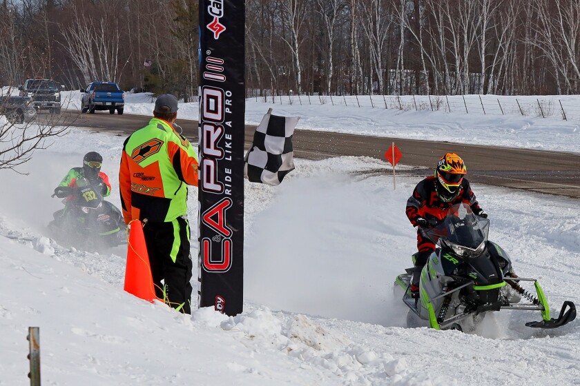 Snowmobilers race