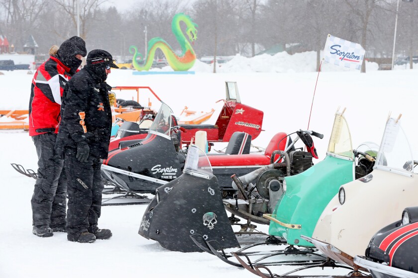 Scorpion snowmobiles and their owners gather on Serpent Lake during the 18th annual Cuyuna Lakes Ice Fishing Contest and Scorpion Homecoming.
