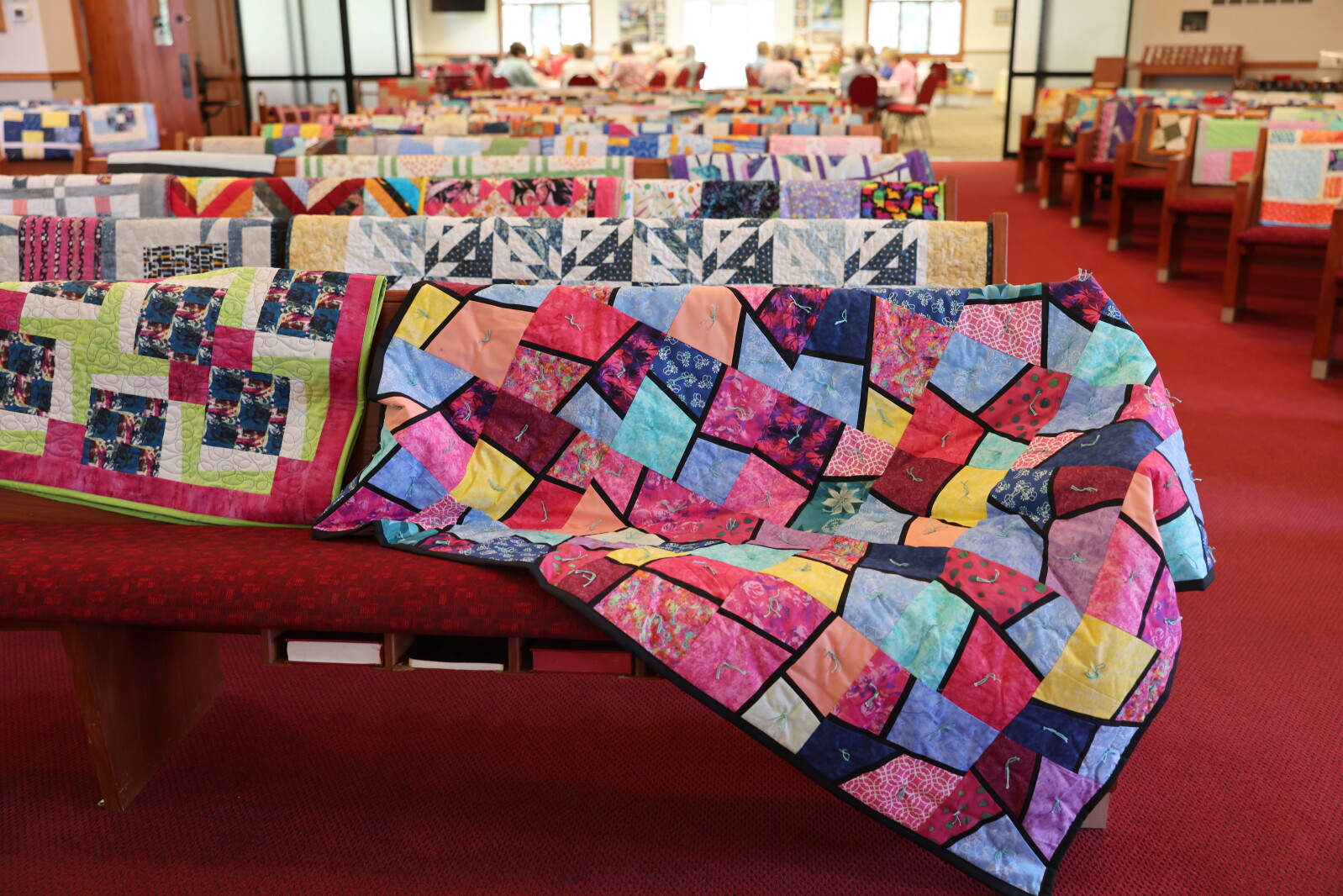 Threads of Love Quilters donates a record 125 quilts