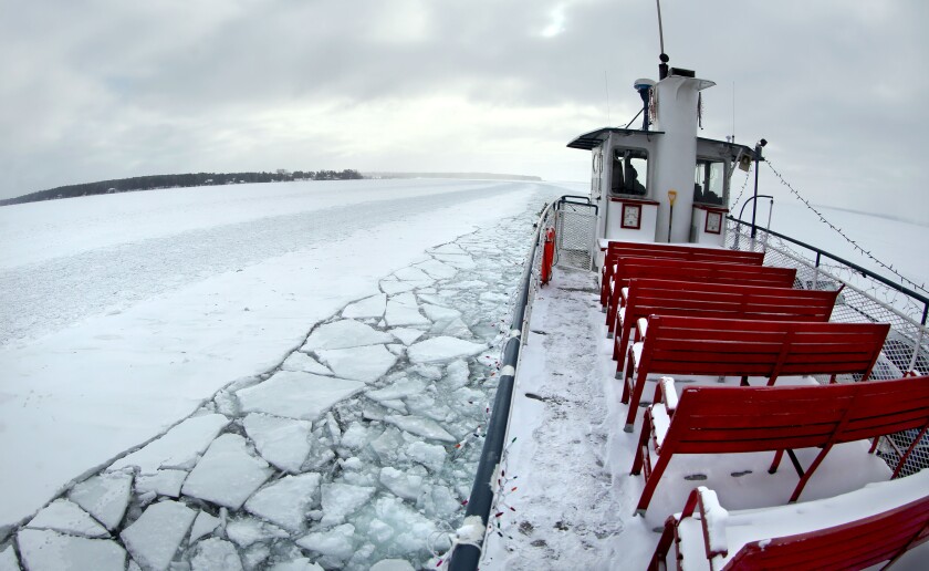 With the temperature at zero and headwinds blowing, few passengers ventured aboard the top deck to take in the view from the Nichevo II as it headed back to Bayfield after picking up passengers at Madeline Island on Friday. Bob King / rking@duluthnews.com