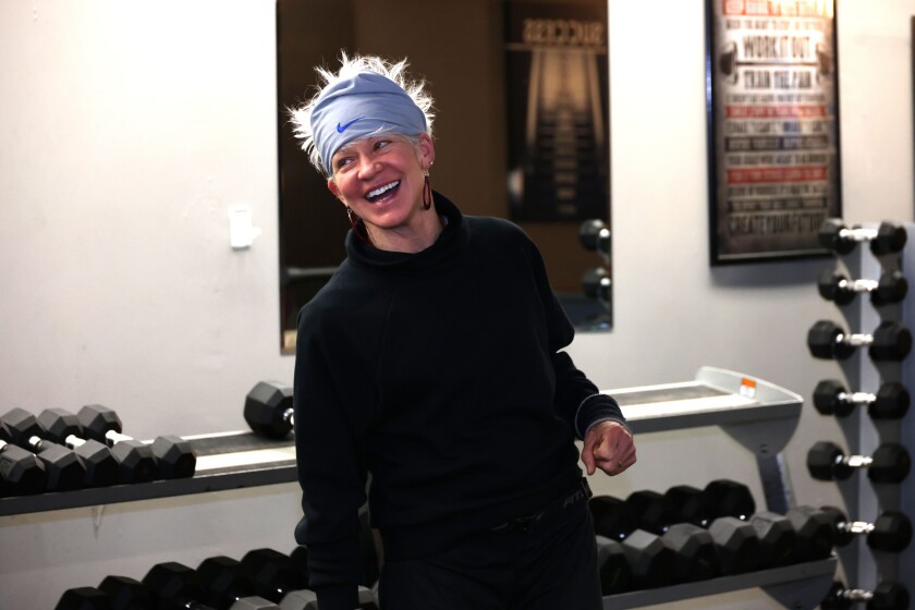 Fitness instructor smiles during class