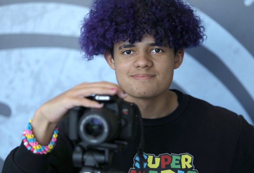 Documentary filmmaker Jayme Ivey poses with a camera