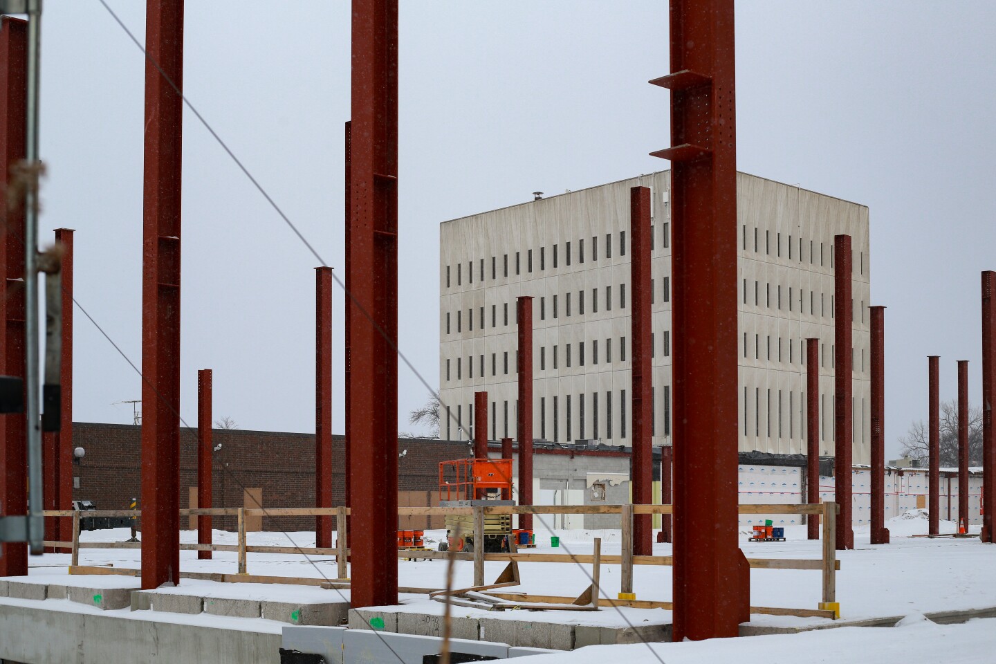 Red construction beams for a building being put up.