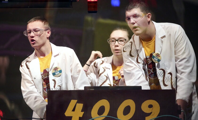 Duluth Denfeld robotics team members David Anderson (from left), Jamie Larson and Kaleb Robison control their robot Saturday during FIRST Robotics regional competition at the DECC. Steve Kuchera / skuchera@duluthnews.com