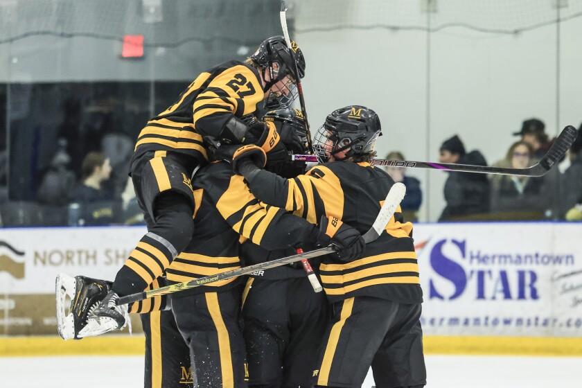 high school boys play ice hockey