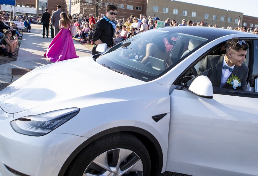 Prom attendees pull up to Willmar High School during grand march on Friday, May 6, 2022.