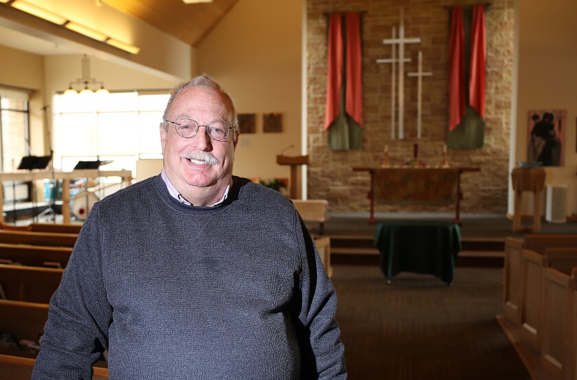 Peace United Church of Christ Interim Pastor Jim Mitulski poses in the sanctuary at the church