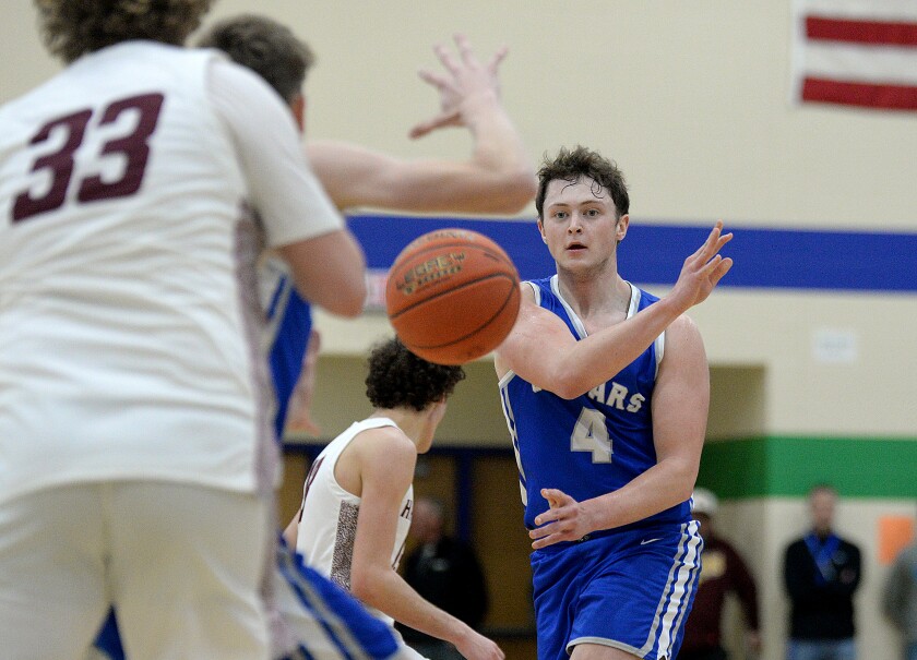 BBE senior Tanner Shelton, 4, whips a pass into the paint during a Section 6A-South semifinal game against Hancock on Monday, March 13, 2023 at Minnewaska High School in Glenwood.