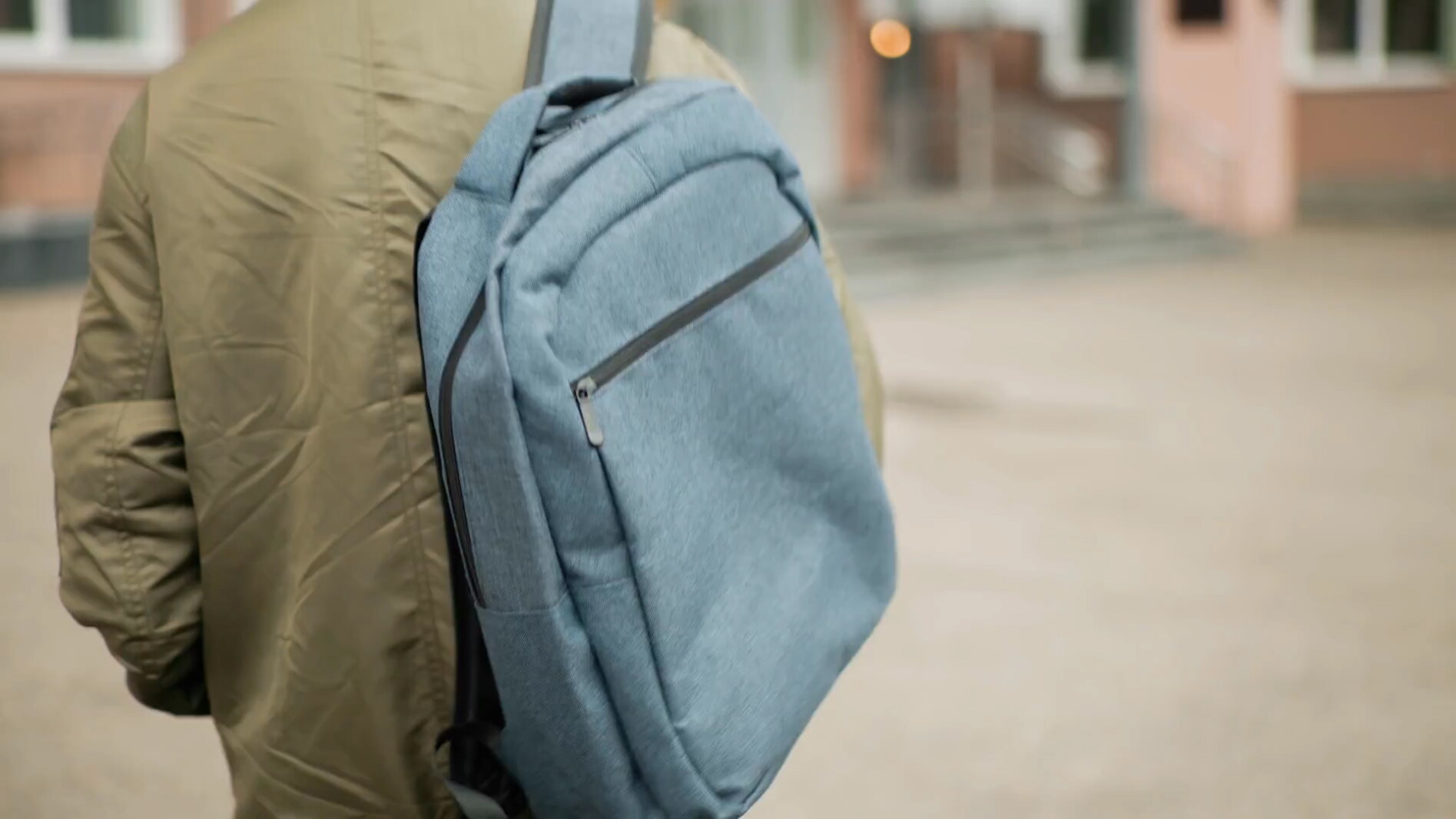 close-up-rear-view-boy-wearing-hoodie-jacket-walking-toward-school-building-with-la-SBV-352713417-HD.mp4.Still001.jpg