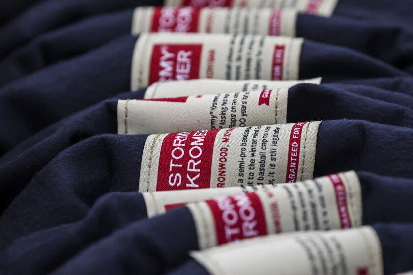 Wool caps with ear bands being made in factory
