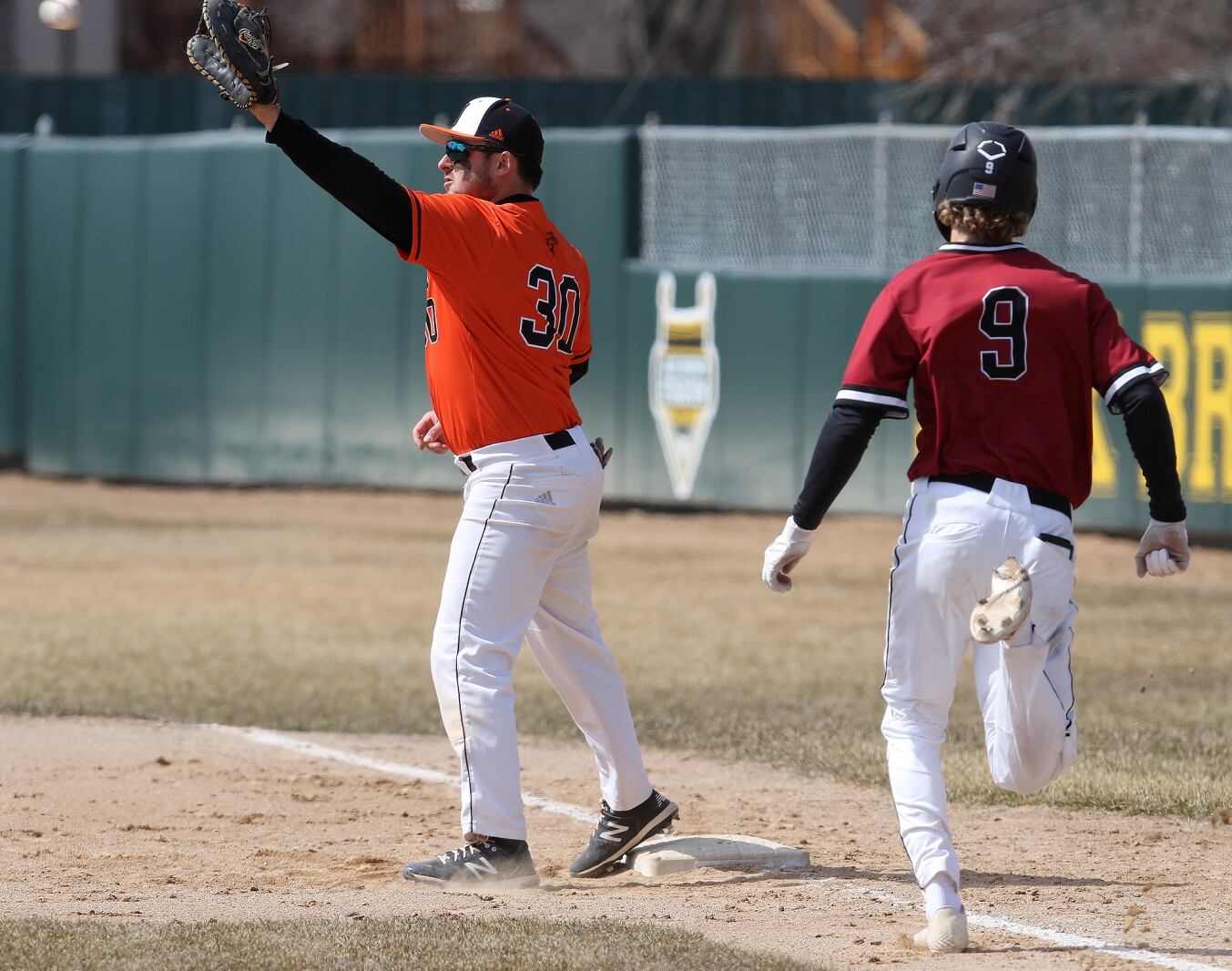 Evan Shepard Evans and Shepard transition into the dugout from the diamond ...