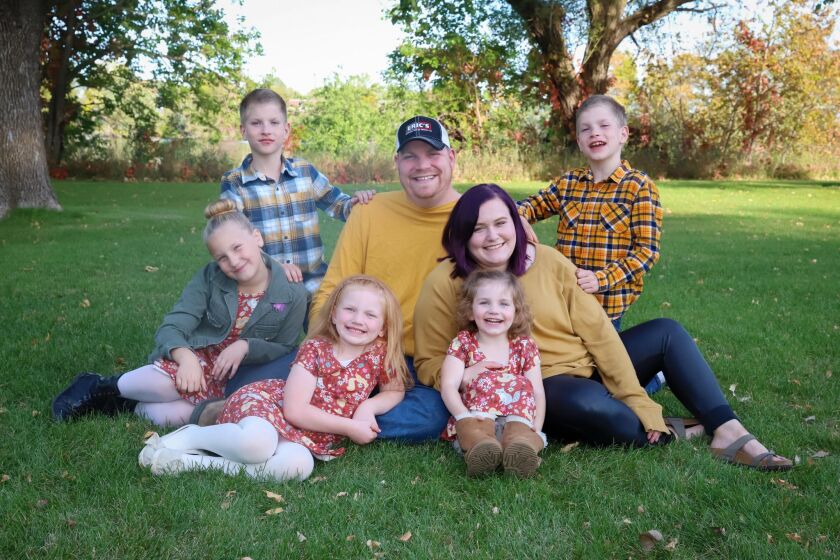 The Jans family gathers for a photograph, including Alaina Jans, front row, second from the left.