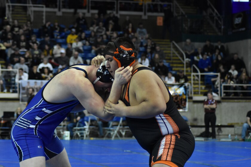 Killdeer's Curtis Hall wrestles with Nathan Weigel of Napoleon-Gackle-Streeter in the 285-pound semifinal on Friday, Feb. 15, at the Fargodome. (Shelby Reardon / The Dickinson Press)