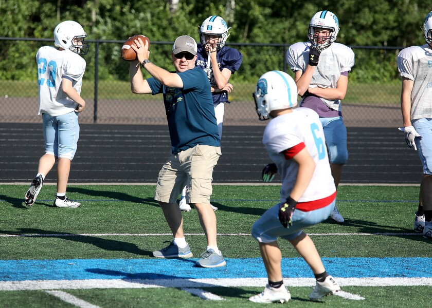 Superior assistant coach Jim Hogan runs the team through drills
