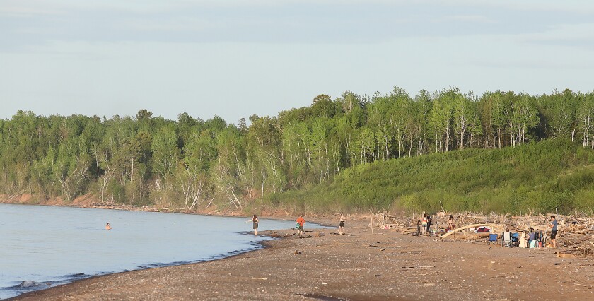 People enjoy the shore of Lake Superior near Lot 1 on Wisconsin Point.