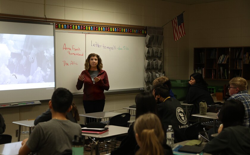 Worthington Middle school teacher Paula Stock discusses with her students how different writers have changed the tone of the ending of a movie about Anne Frank on Friday, May 20, 2022.