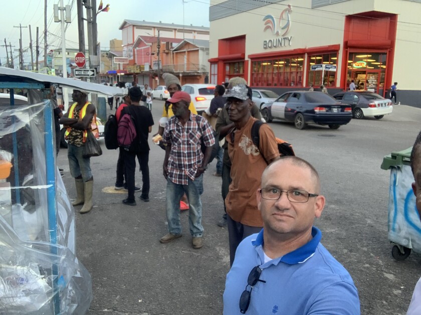 Guyana_Joseph in the Georgetown, Guyana, in front of a new supermarket too expensive for most of the locals.jpeg