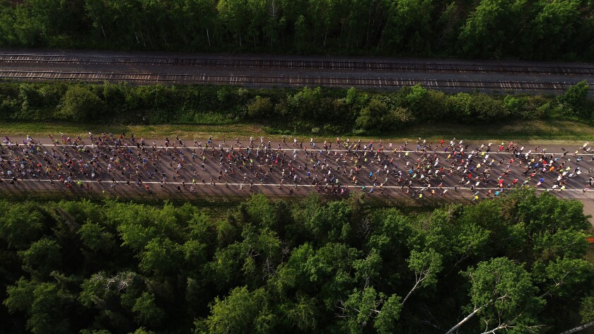 Aerial view of thousands of people running.