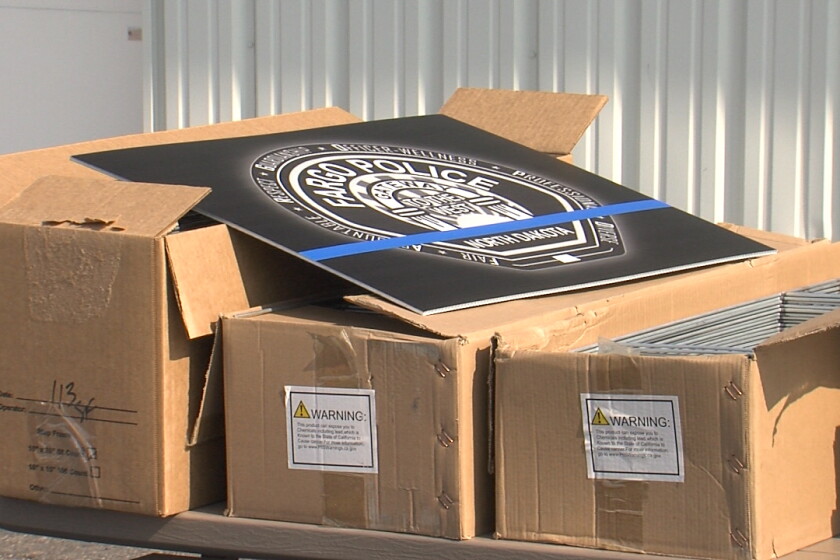 Fargo Pd Graphics Custom Graphics gives out yard signs in support of Fargo Police ...
