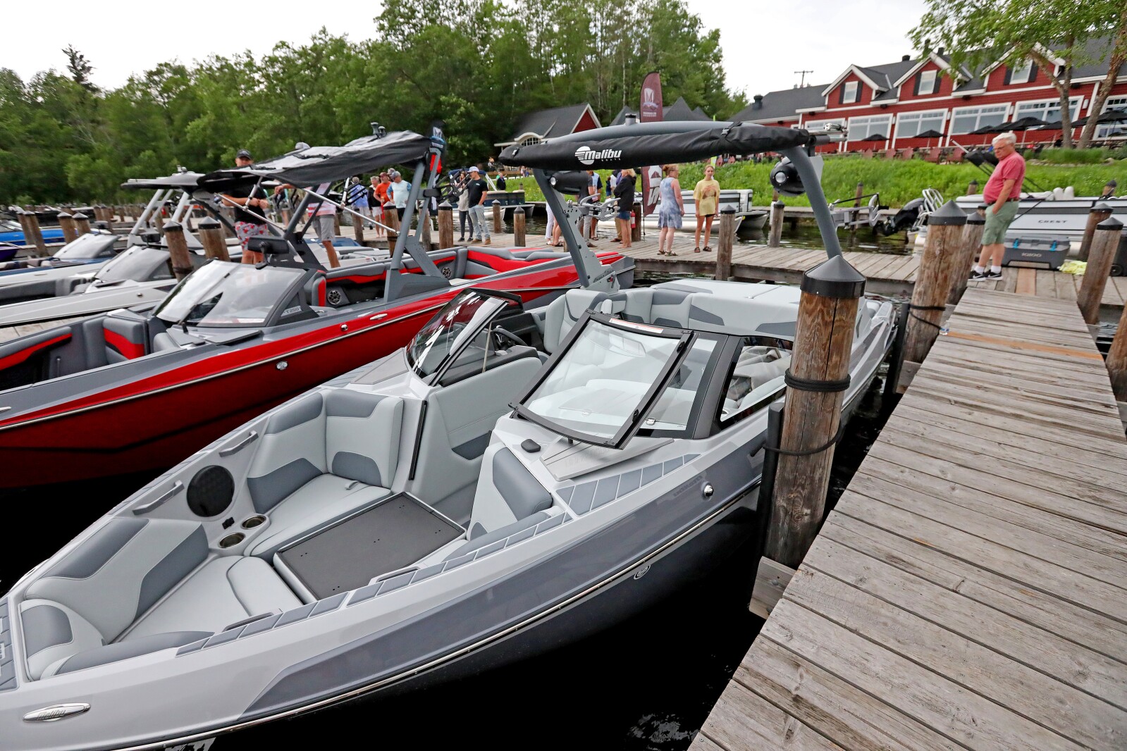 People gather for the ninth annual Bar Harbor In-Water Boat Show on Saturday, June 18, 2022, with boats from Nisswa Marine and Minnesota Inboard Water Sports at the Bar Harbor Supper Club on Gull Lake.