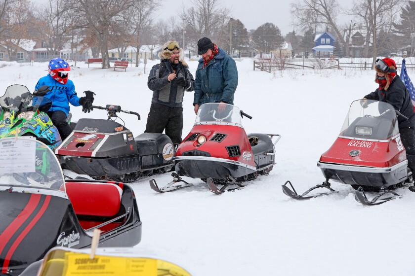 Classic snowmobiles on Serpent Lake in Crosby