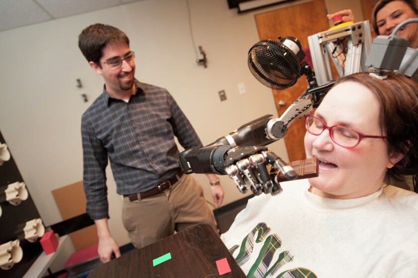 Mind-controlled robotic arm has skill, speed of human limb - Grand ...