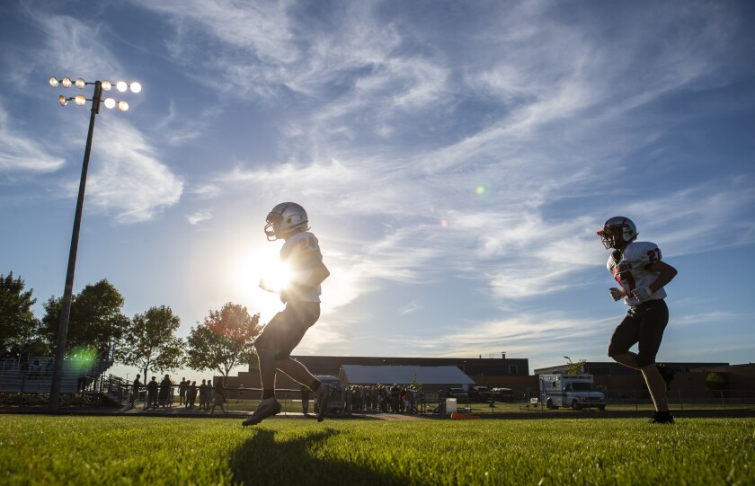 Members of the BOLD Warriors warm up before the opening game of the season against the ACGC Falcons in Grove City on Friday, September 2, 2022.