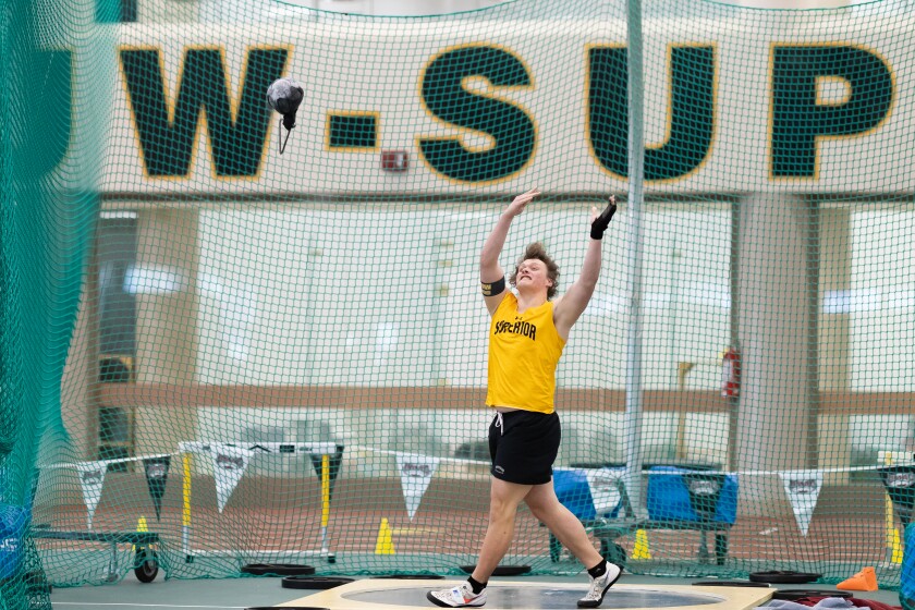 Athlete competes in hammer throw event