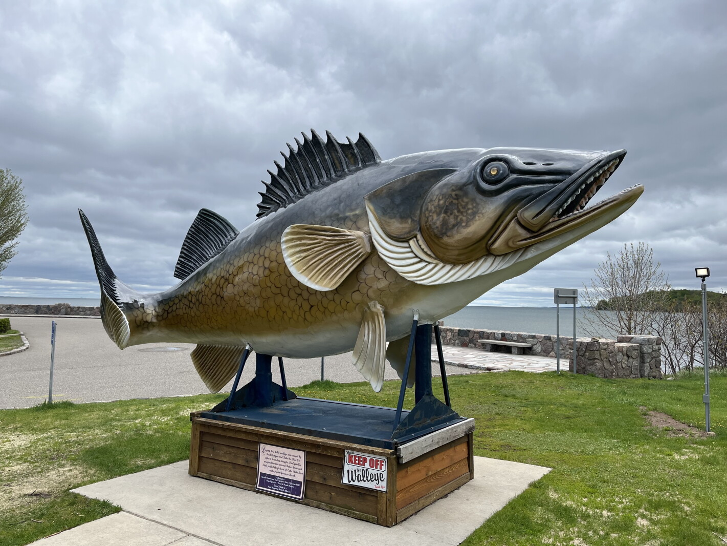 What lakes country town is the world's smallest city with a McDonalds and also has a massive fish tale?