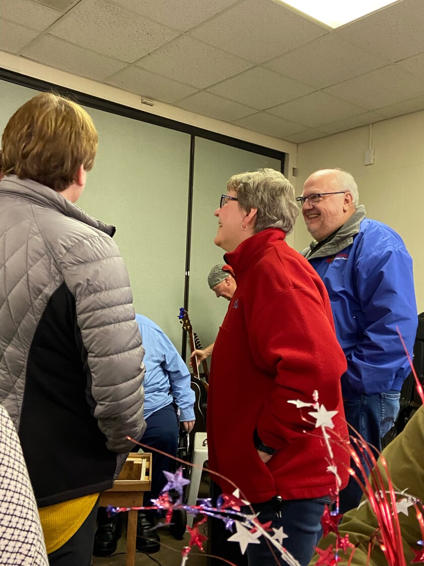 Barb Wallace talking with guests at retirement party.jpeg
