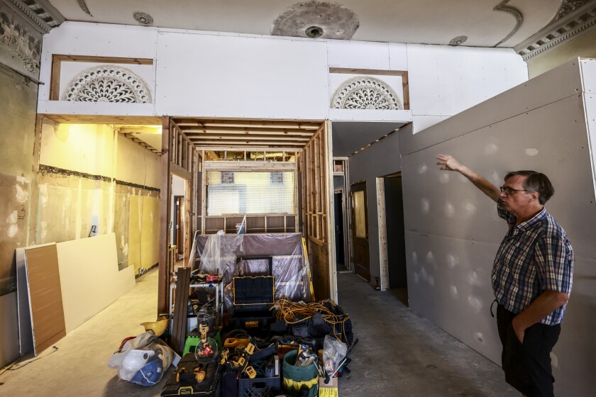 Ornate plaster architectural details inside historic theater under restoration