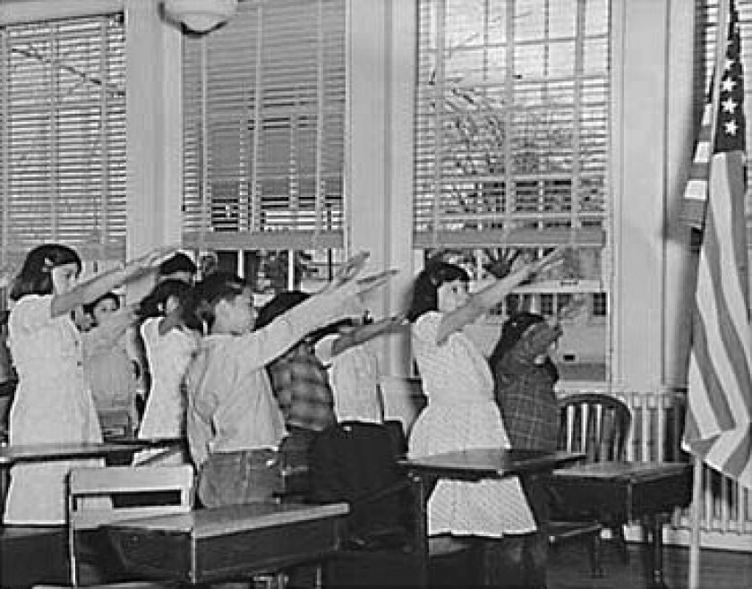 Student_Pledging_allegiance_to_The_American_Flag_with_The_bellamy_salute.jpg