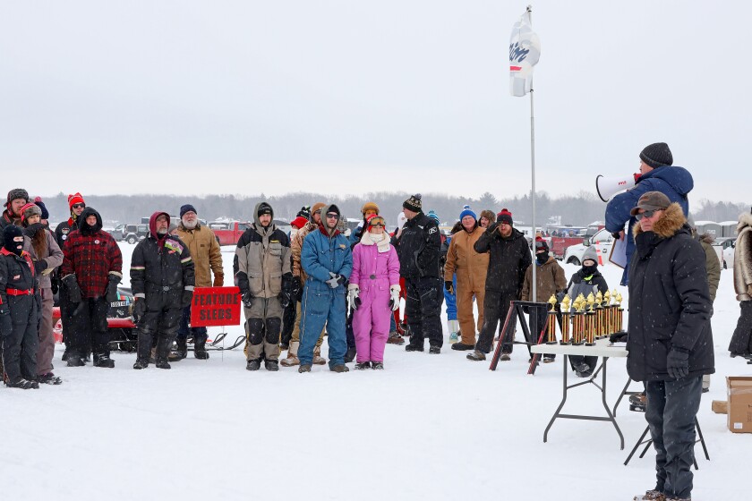 Scorpion snowmobiles and their owners gather on Serpent Lake during the 18th annual Cuyuna Lakes Ice Fishing Contest and Scorpion Homecoming.