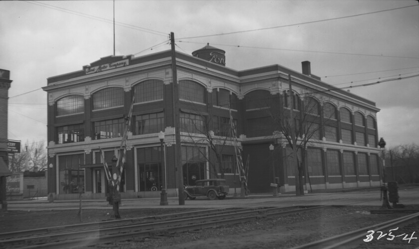 a historical image of a multi-story brick factory